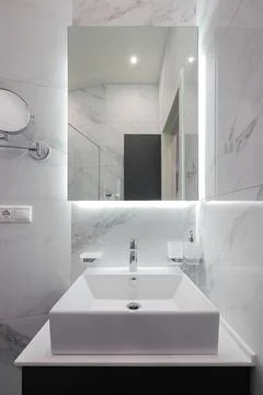 White bathroom sink with mirror Stock Photos