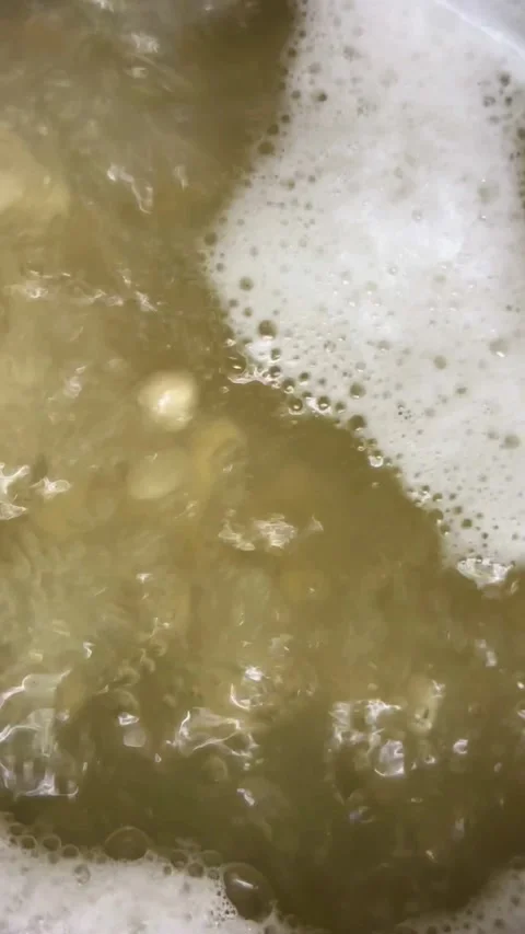 White beans boiling in a pot of hot water Video stock 334593382