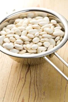 White beans in colander Stock Photos