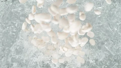 White Beans Falling into Pot of Boiling Water Stock Footage 271399916