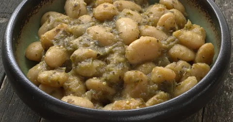 White beans in Mexican tomatillo salsa. Stock Footage 279770217