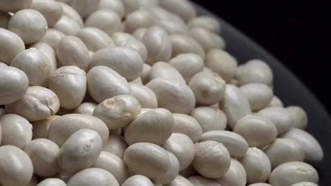 White beans in rotation. Close-up. Stock Footage 100818443