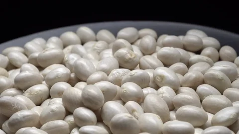 White beans in rotation. Close-up. Stock Footage 100819185