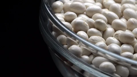 White beans in rotation. Close-up. Stock Footage 100820445
