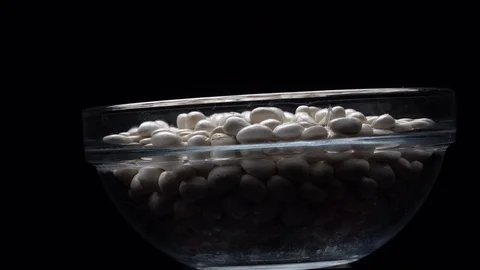 White beans in rotation. Close-up. Stock Footage 100820913