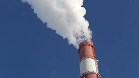 White beautiful smoke from a chimney on a blue sky. Stock Footage 85907976