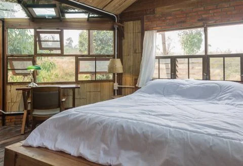 White Bed and Work Table in Country Interior Design Room Style Stock Photos