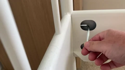 White bed frame being adjusted by an adult with a diy tool Video stock 136467032