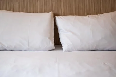 .White bed sheets and pillows Stock Photos