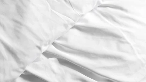 White bedsheets and soft blanket on plain background, minimalistic bedroom .. Stock Photos