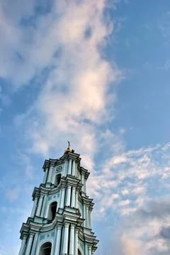 White belfry inside under cloudy sky  Stock Photos