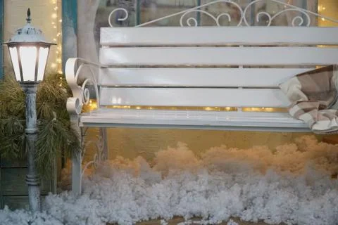 White bench is behind the lantern. lighting in the dark, privacy with loved o Stock Photos