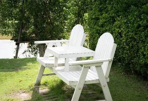 White bench in the garden Stock Photos