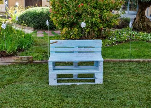 White bench on the grass Stock Photos