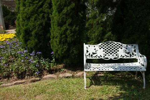 White bench under the tree Stock Photos