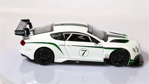 White Bentley Continental scale model sports car is rotating isolated on white. Stock-Footage 101688257