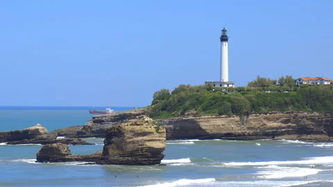 White Biarritz Lighthouse on Pointe Saint-Martin rising above the Atlantic sea Vidéo 340209597
