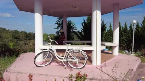White bicycle at a viewpoint Stock Footage 148733935