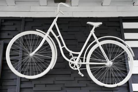 White bicycle on the wall Stock Photos