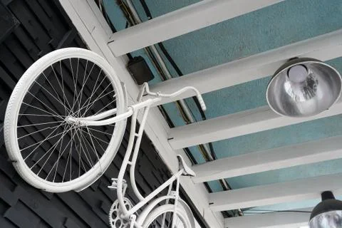 White bicycle on the wall Stock Photos