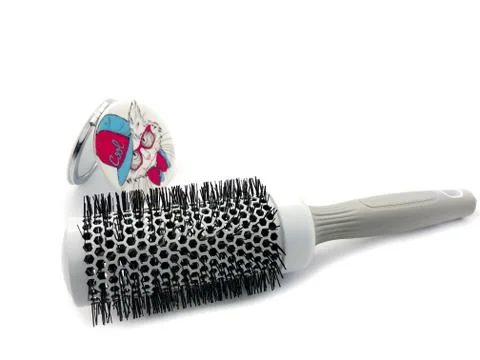 White big comb with a white mirror isolated on a white background Stock Photos