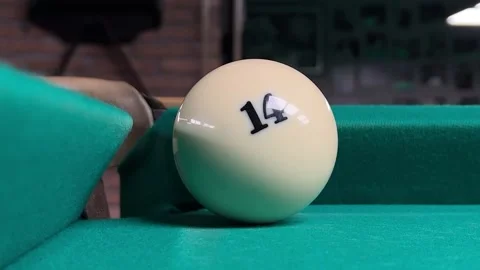 White billiard ball with number 14 falls in pocket Stock Footage 294635243