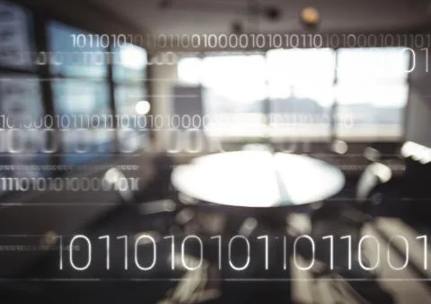 White binary code against blurry office Stock Photos