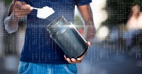 White binary code and flare over man taking supplement against blurry street 写真素材