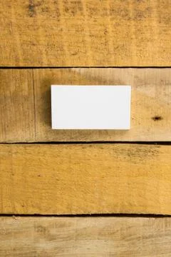 White blank business visit card, gift, ticket, pass, on wooden table Stock Photos