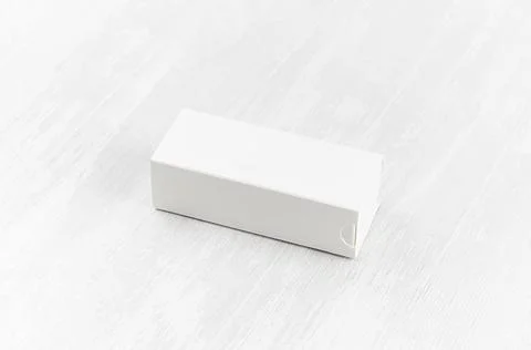White blank closed paper rectangle box mock up on soft light white wood board Stock Photos