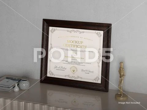 White Blank Cretificate inside Wooden Frame on a Table PSD Template