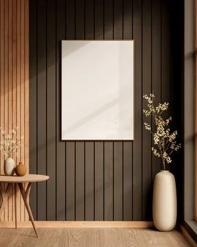 White blank frame on slat wall over wooden table and flower vase with sunli.. Ilustração Stock