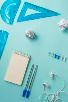 White blank Notepad on a blue background, office supplies Stock Photos