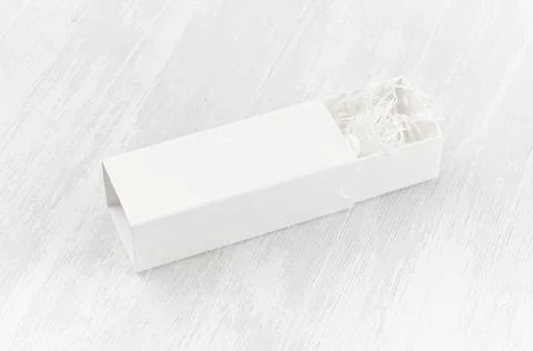 White blank open rectangle box with filler mock up on wood board side view fo Stock Photos