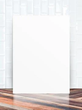 White Blank Poster in ceramic tile wall and diagonal wooden floor room,Temp.. Stock Photos