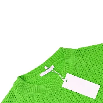 White blank rectangular clothing tag on green knitted sweater isolated on wh Stock Photos