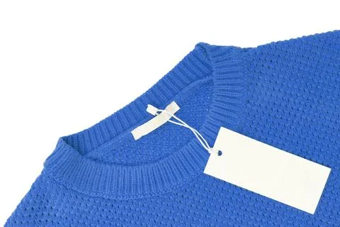 White blank rectangular clothing tag on blue knitted sweater isolated on wh.. 写真素材