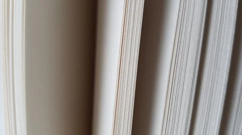 White blank sheets of thick notepad paper, half opened end view Photos