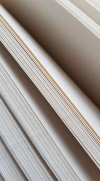 White blank sheets of thick notepad, half opened end view Photos