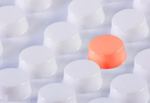 White blister pack with one red pill Stock Photos