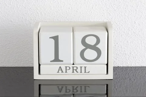 White block calendar present date 18 and month April Stock Photos