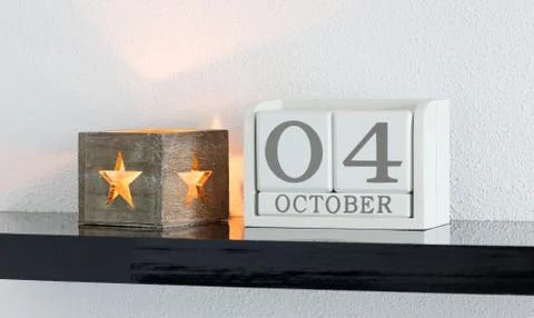 White block calendar present date 4 and month October Stock Photos