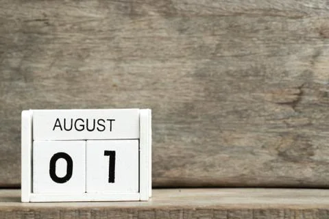White block calendar present date 1 and month August on wood background Stock Photos