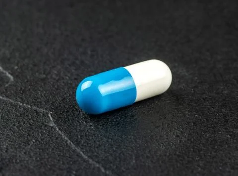 White blue capsule Stock Photos