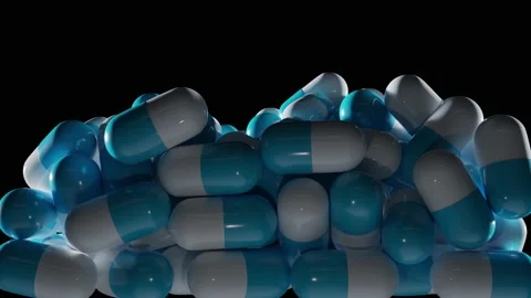 White blue capsule pills falling isolated on black background with alpha Stock Footage 230972939