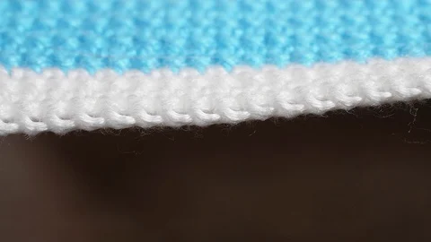 White-blue knitted thing dissolves. Extreme Close-up View. Stock Footage 125253645