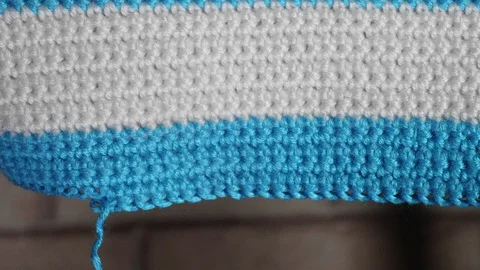 White-blue knitted thing dissolves. Slowmo Extreme Close-up View. Stock Footage 125253689