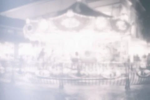 White Blurred Carousel in Carnival Background. Stock Photos