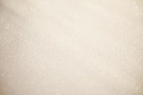 White blurred glitter background with rays of light on it, looks like snow. Stock Photos