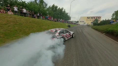 White BMW Compact with Red-Black Decals in Smoky Qualifying Drift Stock Footage 322973247